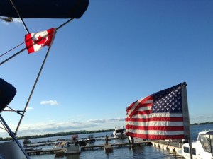 The stern of the Joint Adventure displaying the American flag and a courtesy Canadian flag while in Canada