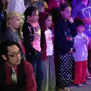 Kids mesmerized watching the fire-eating performance
