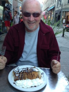 Tom salivating over a fruit/chocolate/ice cream desert crepe after dinner at a sidewalk café in the Old City