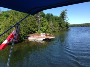 This is a one-car, self operated ferry across one of the cuts.  You drive your car onto the ferry, then use a hand crank on the ferry that is connected to a chain that runs along the bottom from one side to the other.  As you crank, the chain pulls you to the other side, where you tie up the ferry.  There is also a crank on either shore to pull the ferry back if it is on the other side when you arrive