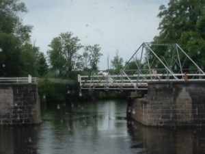 The Canal is often quite narrow and has depths as low as 4 1/2 feet.  This is a swing bridge in the process of opening for us with a narrow passage that left only a few feet between concrete abutments on either side of the boat as we passed