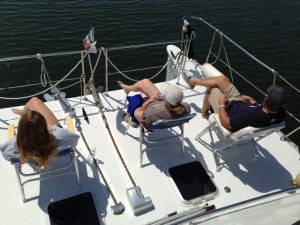 Relaxing on the "front porch" as we transit a calm portion of the Seaway - the Joint Adventure is 17' wide.  While creating some docking challenges at times, it affords a very generous amount of deck space