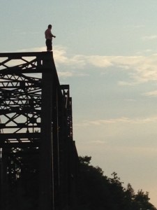 I could lie and pretend this was me getting ready to jump off the top of the abandoned railroad bridge, but everyone knows I'm really a wuss - it's a local kid who came for swim late in the day