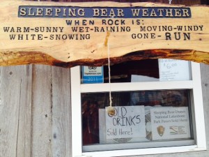 A sign in Fishtown to assist tourists in determining the weather at Sleeping Bear Park 