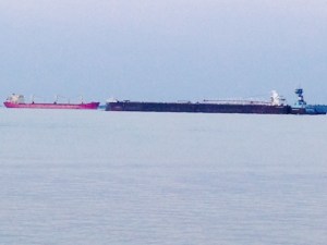 We haven't seen commercial freighters since we turned off the St. Lawrence River onto the Ottawa River in June. Freighters are a frequent site in DeTour, as the main shipping channel from Lake Superior to Lake Huron and on through Lakes Erie and Ontario then the St. Lawrence Seaway, passes through the channel, right by the docks in DeTour. These ships are not about to collide - the red one is actually anchored further back than the black one