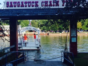 Saugutuck has a chain ferry that will take you across the river on demand - the ferry is literally connected to a chain that rests on the bottom and is attached to the ferry dock on each side. The operator (a college student) turns a crank on the ferry by hand, which pulls the ferry along the chain from one side to the other. It costs $1 - bikes are free!