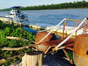 The Joint Adventure tied to the old steel dock. Notice the end of the ramp at the bottom of the picture - the stump is the stepping-stone to get off the ramp