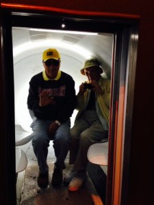 A capsule which is on a track takes you to the top of the arch - Tom and my Dad are in the capsule, ready for blast-off