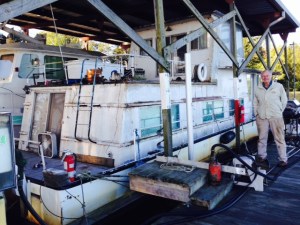 This is John, standing next to his boat in Smithville.  John has lived on the boat at the marina for 15 years. "I seldom take the boat out", said John. "Maybe once a year, if that".  It looked like it had been much longer than that since the boat had moved....