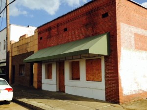 At least half of the storefronts in downtown Aliceville are boarded up and vacant 