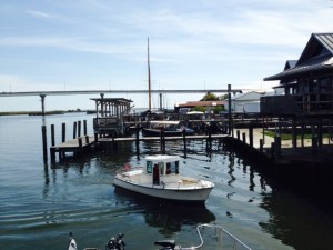A small boat coming into the dock next to the Joint Adventure
