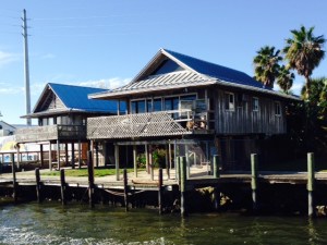 riverfront houses next to the dock, as seen from the bridge of the Joint Adventure