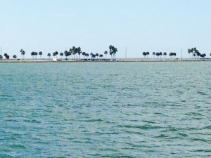 The Intracoastal in this location iseparated from the Gulf only by a narrow spit of beach with some palm trees on it.  This picture reminded me of the Korona commercials "find your beach" theme