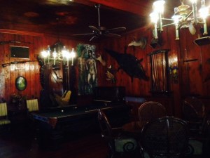 We docked at the Rod & Gun Club on the river in Everglade City. Built in the late 1800's  and appearing from the outside as simply an old wooden lodge, the next few pictures will show the incredible ambiance of the interior. Inside is a time-warp, with the dark hand-crafted wood and the furniture all original from the time it was built. In disrepair and condemned for demolition, it was discovered by the Bowen family when they were stopped on the Tamiami Trail by a downed tree felled by the hurricane in 1960. On the other side of the tree, a man was also stopped as he was trying to go in the other direction. So they simply swapped cars and continued on, and the Bowen family ended up in Everglade City and discovered the Rod & Gun Club building, which they painstakingly restored. 