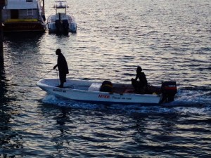 A skiff coming in to Rosie's Place at dusk