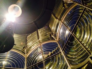 In a previous blog update, I posted a picture of the iconic Hopetown lighthouse. In our second visit, I learned that you could climb the lighthouse at dusk and watch the lighthouse keeper light the ancient kerosene lamp. So up I went, and indeed, with just 2 or 3 other people, was able to participate in the half hour procedure of lighting the light. This picture is taken from inside the lens compartment of the light after the kerosene light was coaxed into burning. It is one of the last manual lighthouses in the world, and burns kerosene with a wick and mantle - much like your Coleman camping lantern. Although it can be seen for 17 miles out to sea, the actual light is no bigger than a Coke bottle - the Fresnel lens concentrates the beam so effectively.  The lens and burner mechanism weighs 8,000 pounds but floats on a bed of liquid mercury - it can thus be rotated by the push of a finger (which I did). However, the keeper must climb the lighthouse every two hours all night, every night, to re-wind the hand-cranked mechanism that keeps the light beam rotating.