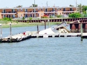 Most of the visual damage from Hurricane Sandy 2 1/2 years ago has been demolished or removed but this sunken boat and damaged dock was a reminder of the massive destruction that New Jersey and New York City endured.