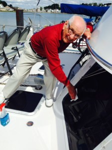 My Dad cleaning the windows on the Joint Adventure as we get ready for our final run of the Great Loop