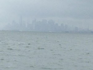 The Manhattan skyline emerges from the fog as we proceed up the Hudson River